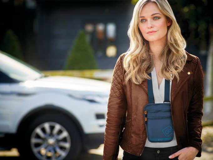 Traveller wearing a Go Travel RFID-blocking crossbody bag